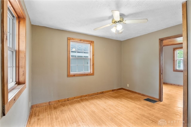 700 James St, Springfield, OH 45503 - unfurnished room with light wood finished floors, baseboards, and a ceiling fan