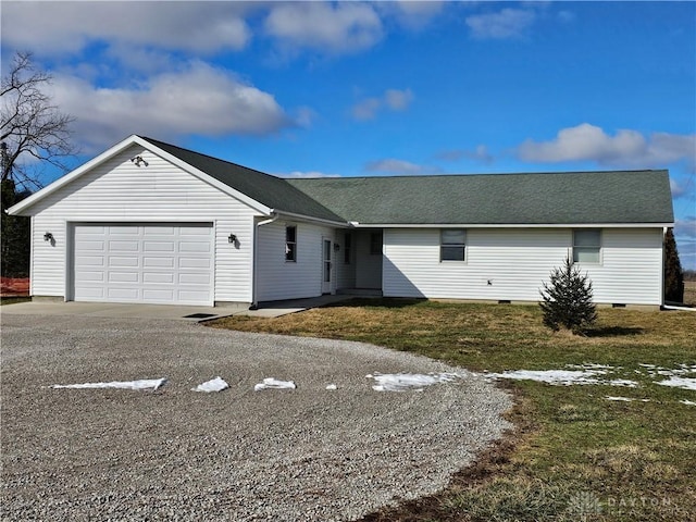 ranch-style house with a garage and a front yard