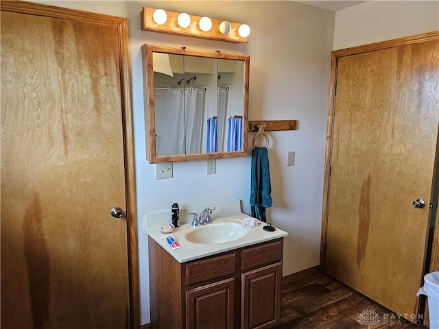 bathroom featuring vanity and hardwood / wood-style floors