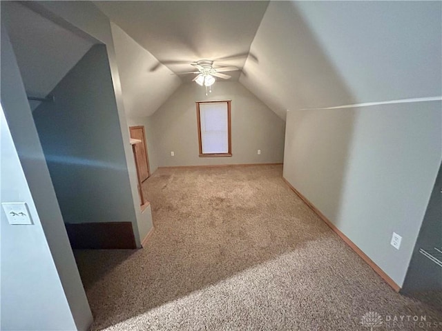 bonus room with lofted ceiling, ceiling fan, and carpet