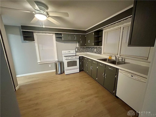 kitchen featuring sink, decorative backsplash, ceiling fan, white appliances, and light hardwood / wood-style flooring