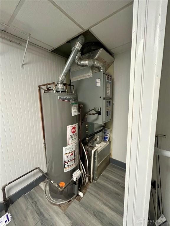 utility room with water heater