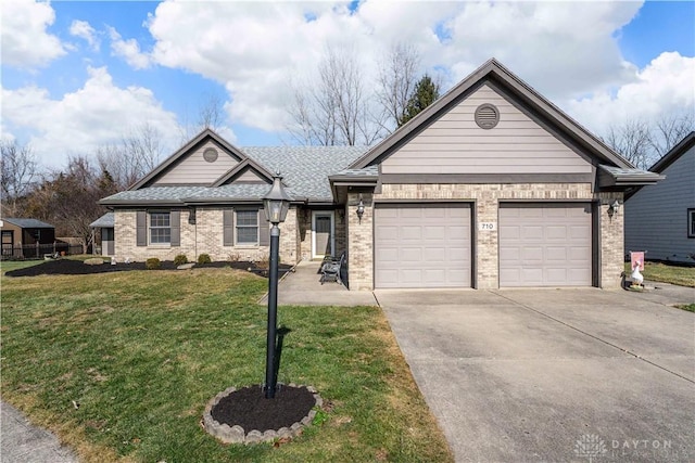 view of front of home featuring a garage and a front lawn