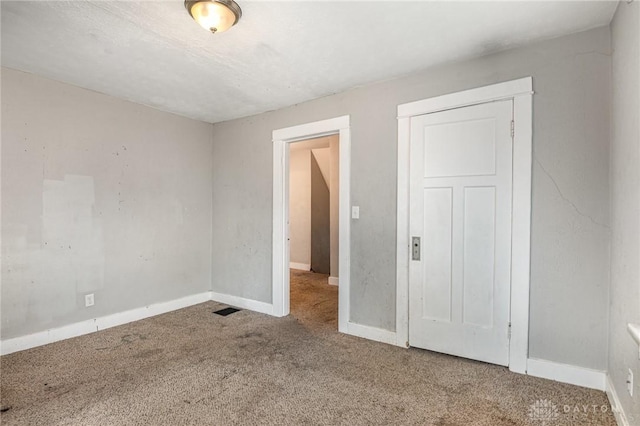 unfurnished bedroom featuring carpet flooring