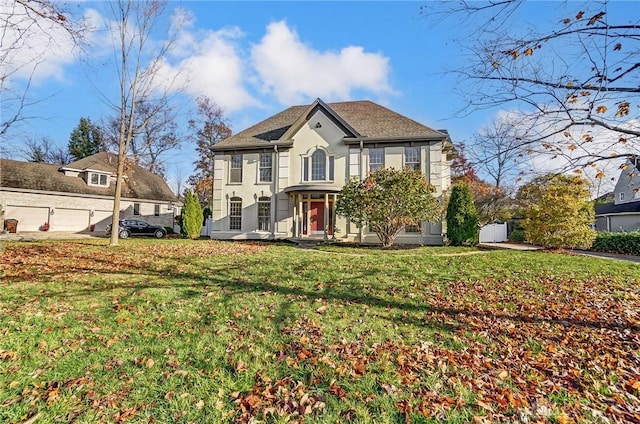 colonial-style house with a front yard