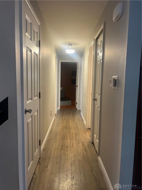 corridor featuring light hardwood / wood-style floors