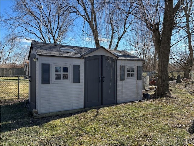 view of outbuilding featuring a lawn