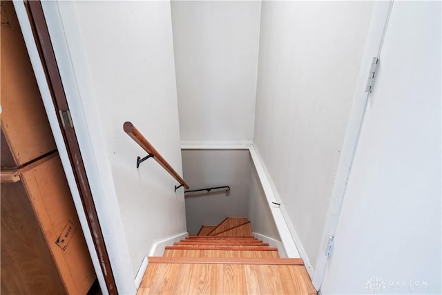 stairs with wood-type flooring