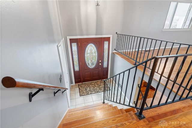 tiled foyer featuring baseboards