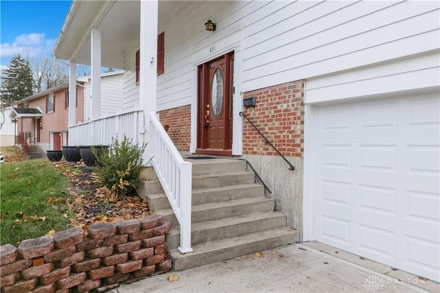 property entrance with brick siding