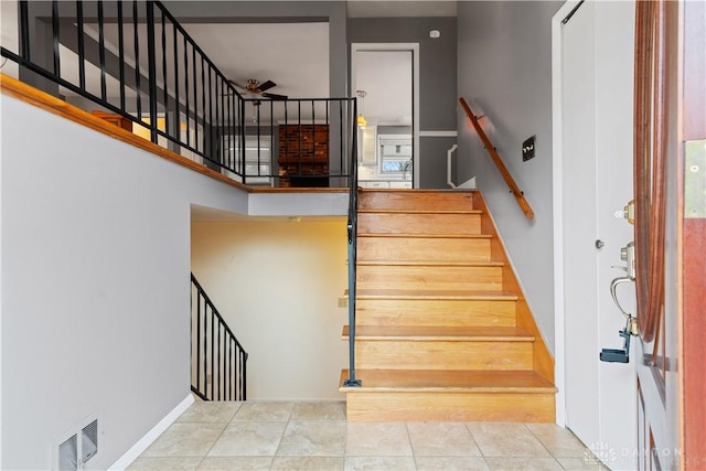 stairs with tile patterned floors