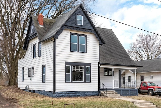 exterior space featuring a front yard and covered porch