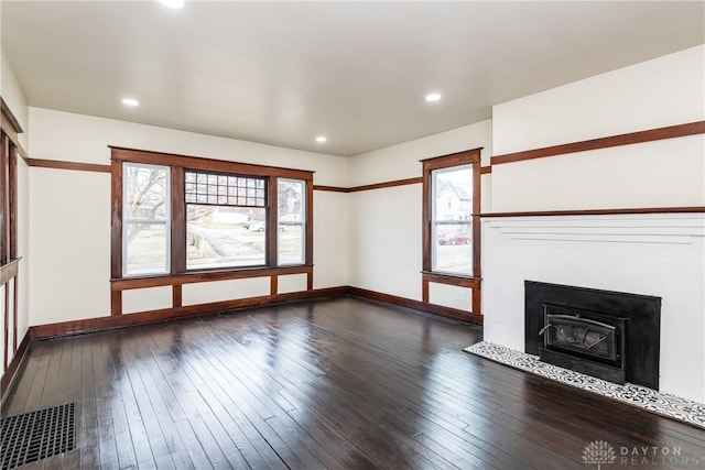 unfurnished living room with wood-type flooring