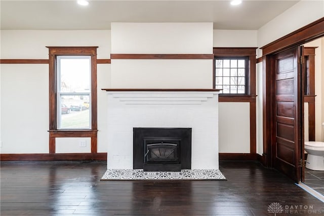 details featuring wood-type flooring and a brick fireplace