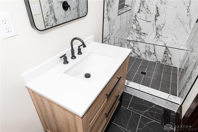 bathroom with vanity and walk in shower