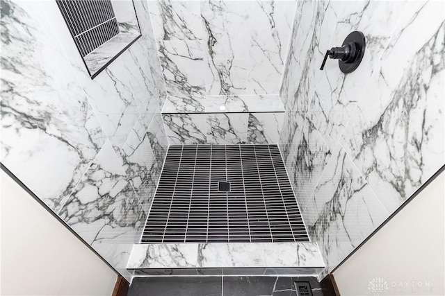 room details with a tile shower