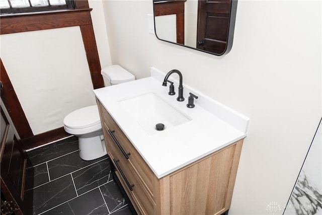 bathroom with vanity and toilet