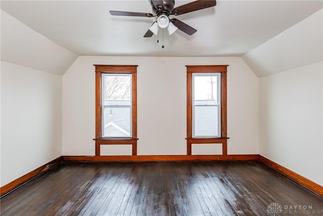 bonus room featuring ceiling fan, lofted ceiling, plenty of natural light, and dark hardwood / wood-style flooring