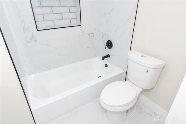 bathroom featuring tiled shower / bath and toilet