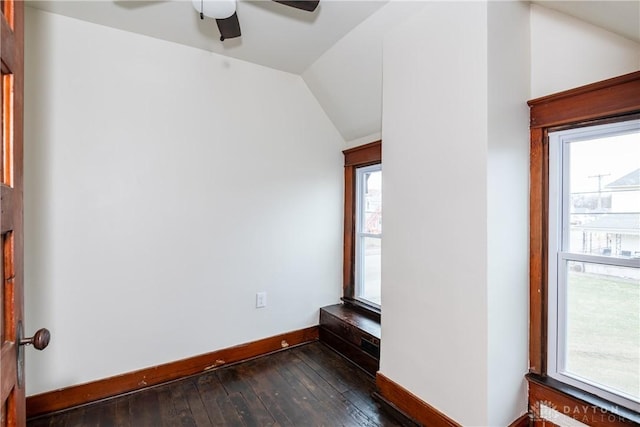 spare room featuring ceiling fan, dark hardwood / wood-style flooring, and vaulted ceiling