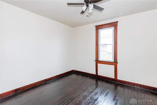 spare room featuring hardwood / wood-style flooring and ceiling fan