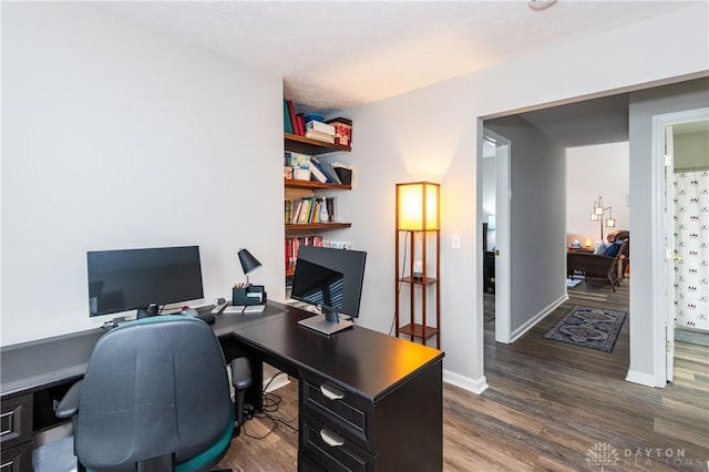 home office featuring dark wood-type flooring