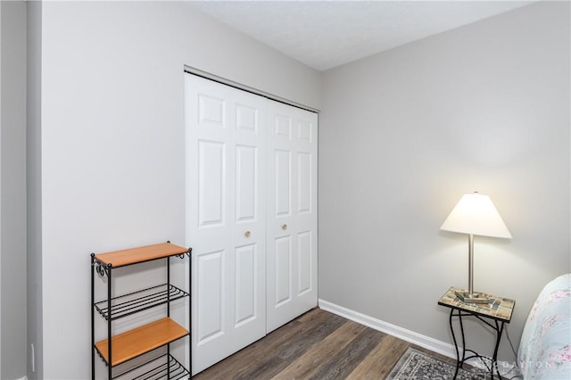 living area with dark hardwood / wood-style flooring