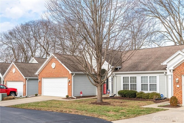 view of front facade featuring a garage and a front lawn