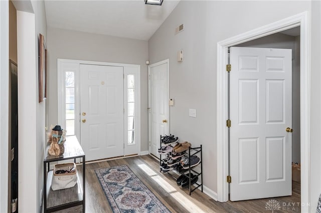 foyer entrance featuring dark hardwood / wood-style flooring