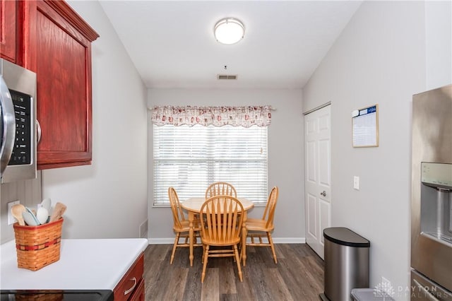 dining room with dark wood-type flooring