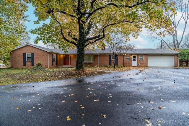 ranch-style home with a garage