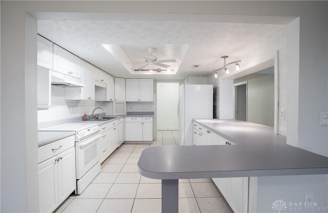 kitchen with white cabinetry, sink, a textured ceiling, and white appliances