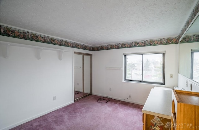 interior space with a textured ceiling and carpet