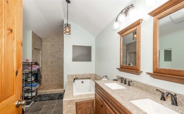 bathroom featuring tile patterned flooring, vanity, lofted ceiling, and plus walk in shower
