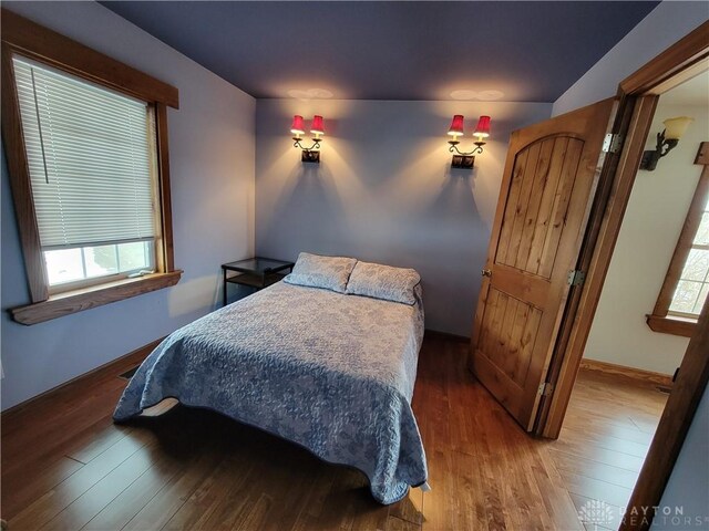 bedroom with hardwood / wood-style floors