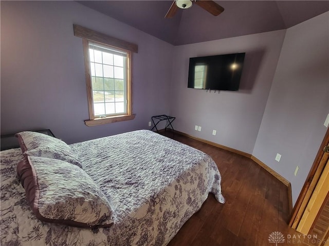 bedroom featuring lofted ceiling, dark hardwood / wood-style floors, and ceiling fan