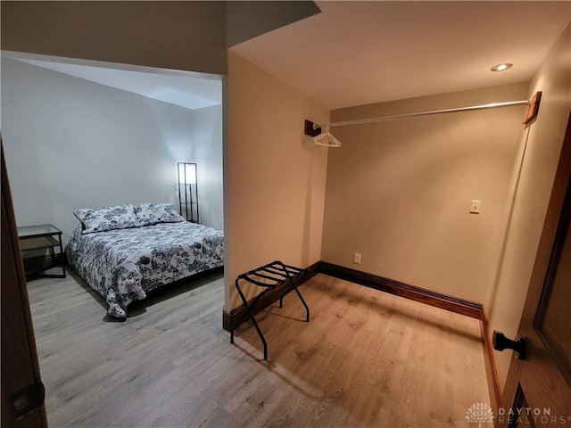 bedroom with light wood-type flooring