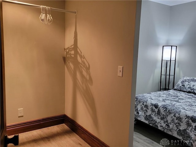 bedroom with hardwood / wood-style flooring
