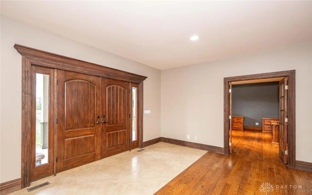 foyer with dark hardwood / wood-style flooring