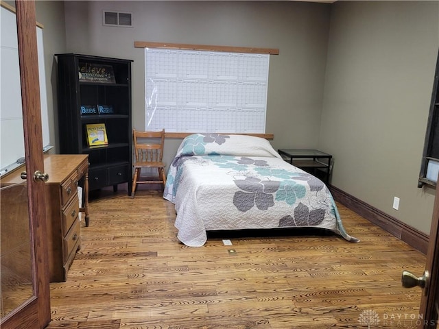 bedroom featuring light hardwood / wood-style flooring