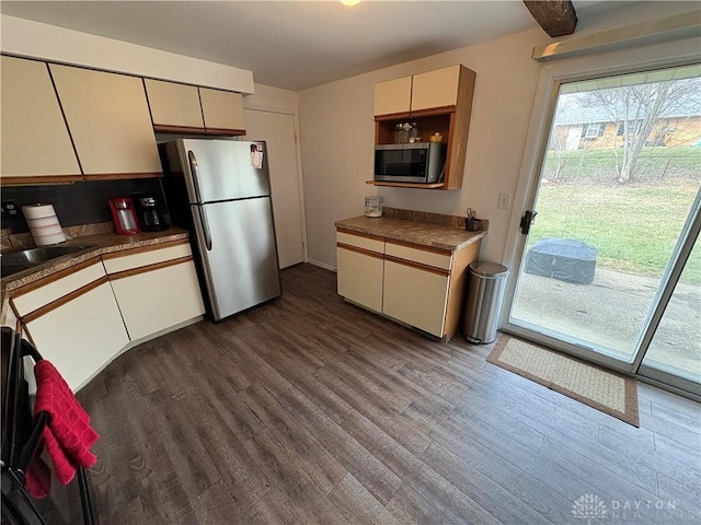 kitchen with sink, light hardwood / wood-style flooring, and appliances with stainless steel finishes