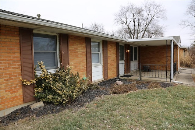 view of side of property with a yard