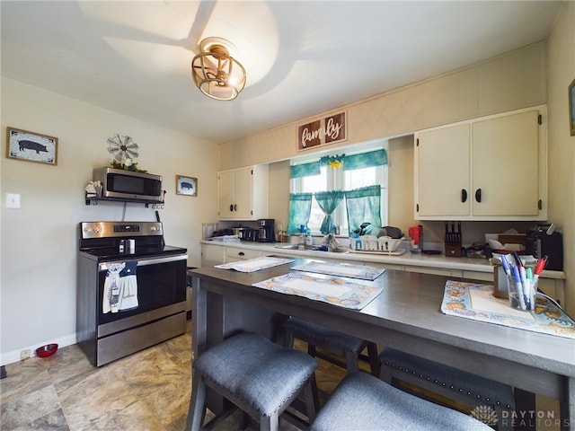 kitchen featuring appliances with stainless steel finishes and sink