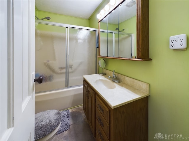 bathroom with vanity and bath / shower combo with glass door