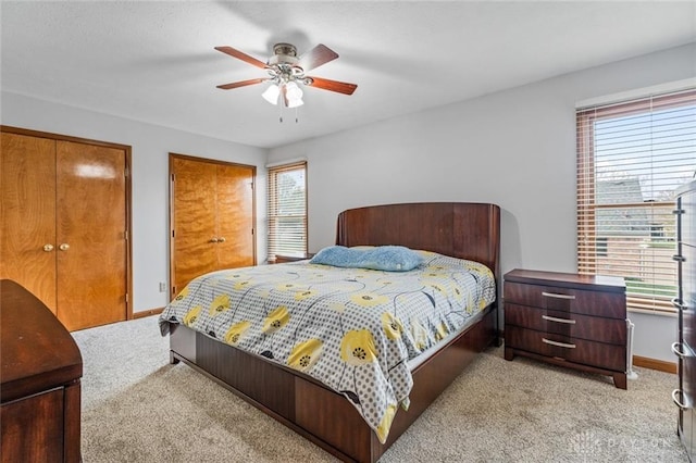 bedroom featuring ceiling fan and light colored carpet