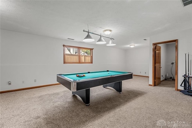 game room with pool table, carpet flooring, and a textured ceiling