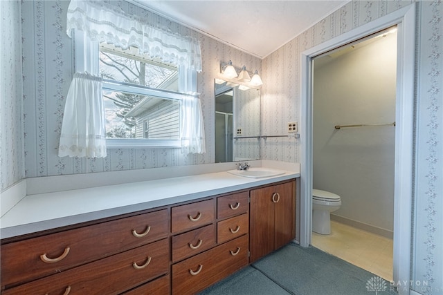 bathroom with vanity and toilet