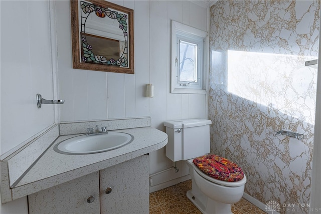 bathroom featuring vanity and toilet