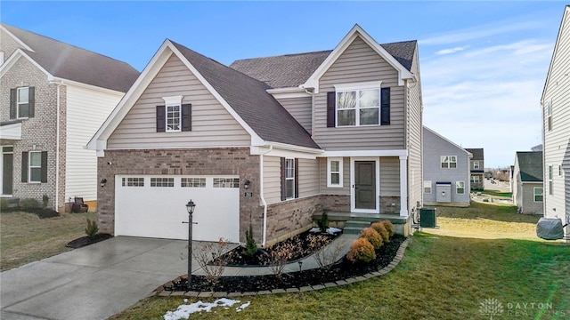 view of front of house with cooling unit, a garage, and a front lawn