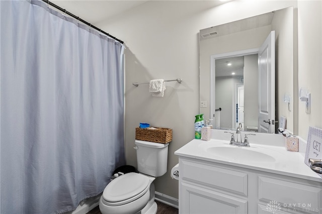 bathroom with vanity, toilet, and a shower with shower curtain